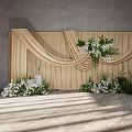 Elegant Banquet Hall Setup With Beige Drapery White Flowers And Greenery Decor