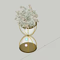 Banquet Hall Decor With Hourglass Shaped Golden Frame White Flowers And Illuminated Spheres