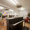 Music Classroom Interior With Piano Wooden Floor Chairs Blackboard And Windows