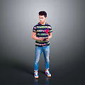 Man holding tablet in colorful striped T-shirt blue jeans and sneakers standing against gray background