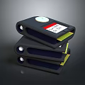Stacked Black Electronic Devices With Circular Buttons Labels And Yellow Interior Parts