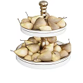 Ripe Fresh Pears Arranged on Two Tiered White Fruit Stand with Golden Base
