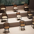 Various Styles of Rattan Chairs Displayed on Tiered Platforms with Natural Backdrop