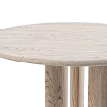 Round Natural Oak Dining Table With Cylindrical Legs And Smooth Surface In Modern Design