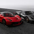 Red and Gray Sports Cars Parked Side by Side on Open Road