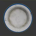 Round Sculpture Carving With Blue Rim White Interior And Textured Surface