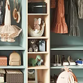 Organized Teal Open Wardrobe With Hanging Clothes Folded Towels Books And Shoes