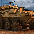 US Army Wheeled Tan Colored Tank With Turret And Machine Gun On Dirt Ground