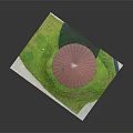 Circular Stone Building Model On White Base With Red Roof And Green Grass