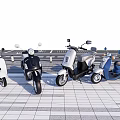 Four Different Colored Motorcycles Parked Side By Side On Gray Tiled Pavement