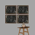 Four Framed Artworks Featuring Animal Figures Abstract Designs And Vase On Wooden Table
