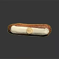 Fresh Cream Filled Eclair Pastry With White Icing And Golden Label
