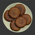 Delicious Golden Round Textured Pastries Served On White Plate For Tea Time