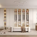 Elegant Modern Walk in Closet With White Cabinets Arched Glass Doors Bench And Rug