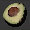 Fresh Half Avocado With Green Flesh And Brown Seed On Gray Background