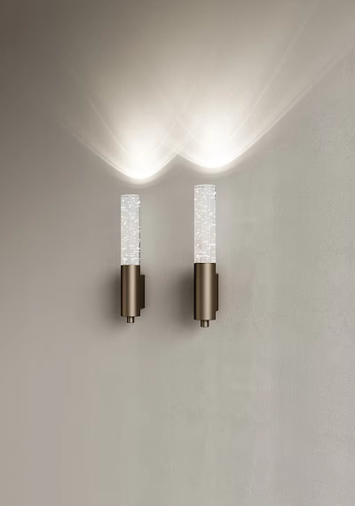 Two Modern Wall Sconces Illuminated With Transparent Crystal And Metal Base Mounted On Gray Wall 3d model