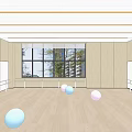 Spacious Indoor Fitness Room Featuring People Exercising With Stability Balls And Handstand On Wooden Floor