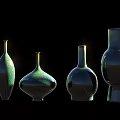 Glossy Green Ceramic Vessels In Various Shapes And Sizes With Black Background Lighting