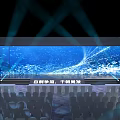 Banquet Hall With Large LED Screen Dynamic Blue Light Effects And Stage Audience Seats