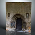 Historic Stone Arched Entrance Gate With Ornate Columns And Carved Details