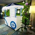 White And Blue Functional Cart With Canopy Wheels And Green Plant Wall Decor