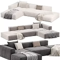 Gray And White Sectional Sofa With Pillows And Blankets For Modern Living Room