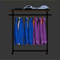 Colorful Casual Shirts Hanging on Metal Clothing Rack with Folded Clothes