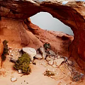 Red Rock Arch Scenic Desert Landscape With Natural Rocks And Small Shrubs