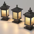 Three Black Outdoor Lights With Stripe Shades Decorative Spires And Square Bases Illuminated