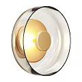 Modern Wall Light With Transparent Glass Shade Golden Interior And Black Frame Emitting Warm Light