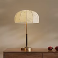 Elegant Table Lamp With Patterned Linen Shade And Brass Black Stand On Wooden Table