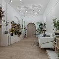 Elegant Home Decor Store With White Walls Arched Doorway Display Shelves White Sofa And Greenery