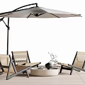 Outdoor Table Chair Set With Loungers Round Table And Umbrella On Wooden Flooring