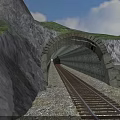 Railway Track Leading To Mountain Tunnel With Green Hills And Blue Sky