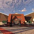 Traditional Chinese Visitor Center With Brick Roof Lanterns And Stone Path