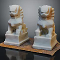 Pair of White Stone Lions Placed On Brown Mat With Detailed Carvings