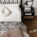 Black Frame Double Bed With White Bedding Throw Blanket Nightstand Table Lamp And Wall Art