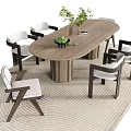 Modern Oval Wooden Dining Table With White Cushioned Chairs And Green Plant On Woven Rug