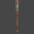 Traditional Decorative Staff with Intricate Top Ornament and Wooden Metal Design on Dark Background