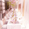Elegant Banquet Hall Decoration With Long Dining Table White Chairs And Pink Floral Arrangements