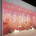 Pink Window Display With White Tree Trunks Red Grass Flamingos Deer Round Lights And Stones