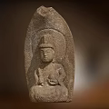 Ancient Stone Buddha Sculpture Carved With Headdress Sitting Posture And Handheld Object