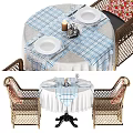 Wicker Chair And Table Set With Blue White Checkered Tablecloth And Lace Trim