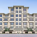 Classical Multistory Building With Symmetrical Design Light Colored Facade Multiple Windows Paved Square And Trees
