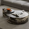 Modern Round Marble Coffee Table With Open Book Glass Of Water And Fruit Tray