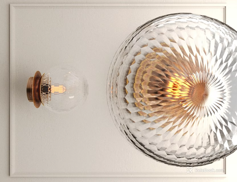 Elegant Modern Wall Sconce With Transparent Cut Glass Shade Brass Base And Warm Light Glow 3d model 