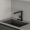 Modern Style Kitchen With Gray White Upper Lower Cabinets Black Oven Light Colored Countertop