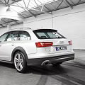 White Audi Avant Station Wagon In Indoor Garage With Tire Tracks On Floor