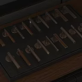 Various Metal And Wooden Furniture Handles Displayed On Wooden Tray With Stylish Designs