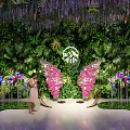 Perfect Photo Spot Featuring Lush Green Plant Wall Hanging Purple Vines And Pink Butterfly Wings